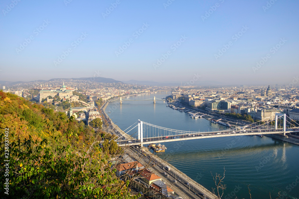 Naklejka premium Scenic view of ancient historic tourist city Budapest and famous river Danube with bridges over it in autumn in morning light in Hungary