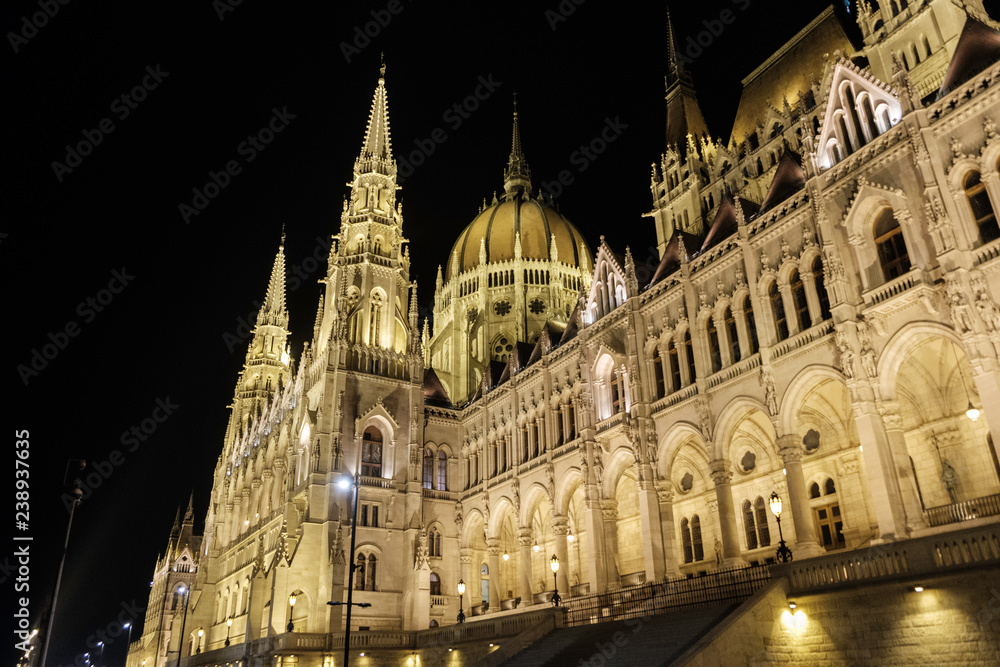 Scenic view of Hungarian parliament in ancient historic tourist city Budapest in nightlight illumination in Hungary