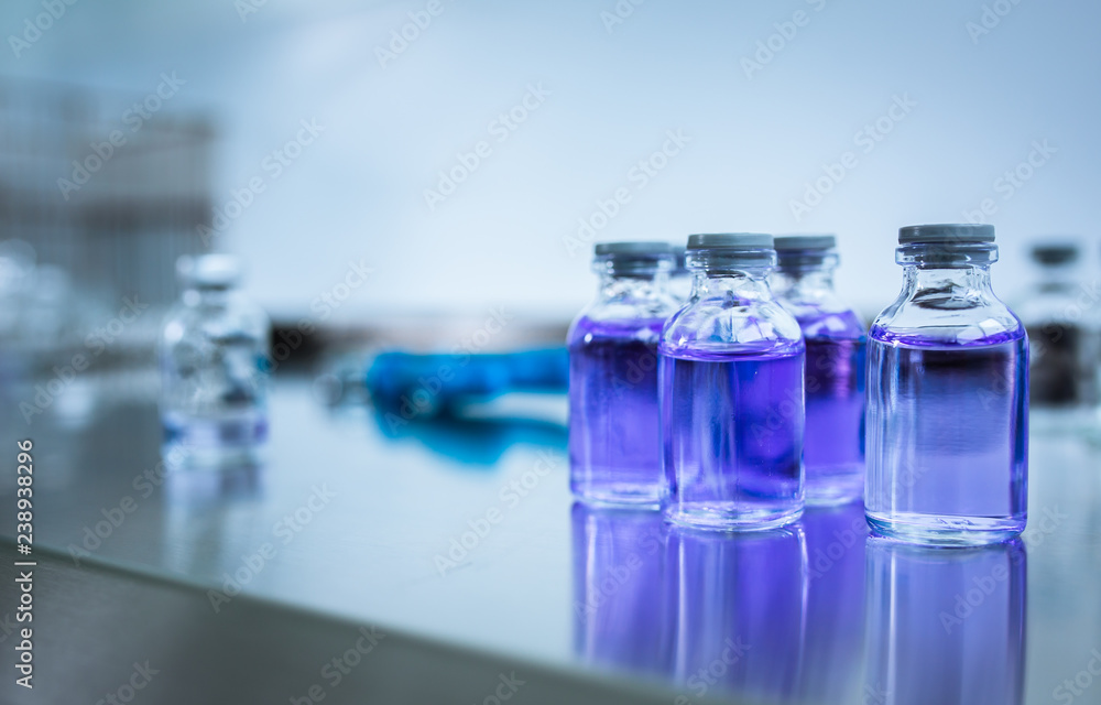 Flasks with liquids in a lab - Pharmaceutical industry factory and production laboratory (color toned image; shallow DOF) Flasks with liquids in a lab - Pharmaceutical industry factory and production laboratory (color toned image; shallow DOF)