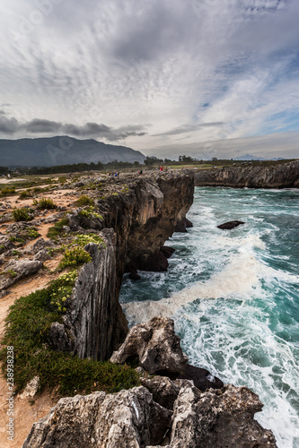 Cliffs and bufones (blowholes) of Pria in Llanes, Asturias. Spain. photo