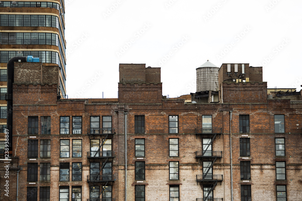 Close-up view of New York's buildings with water tanks on the rooftop. Manhattan, New York City, USA.