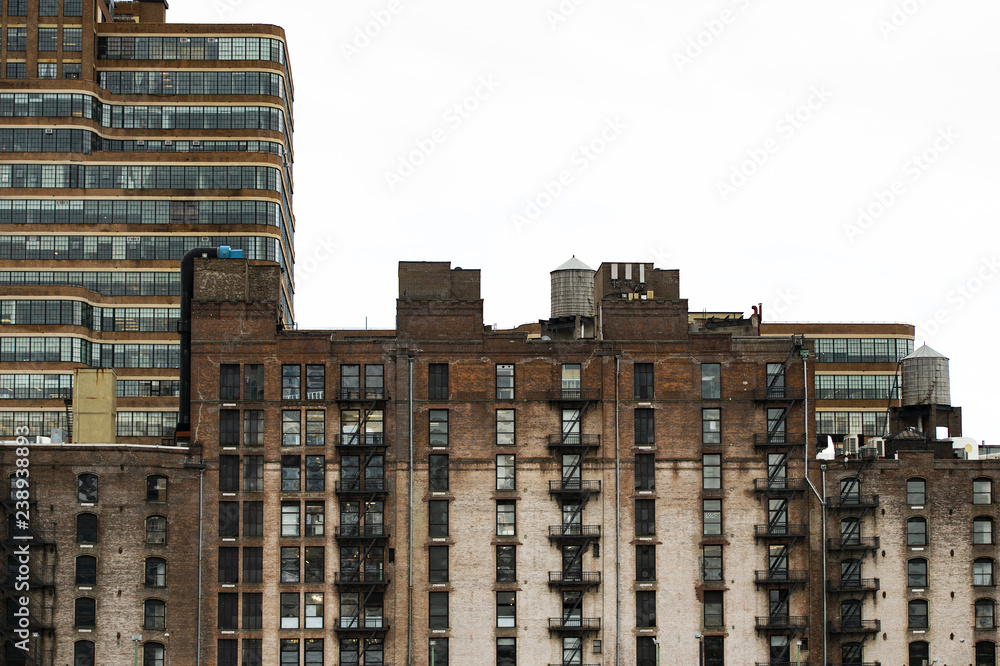 Close-up view of New York's buildings with water tanks on the rooftop. Manhattan, New York City, USA.