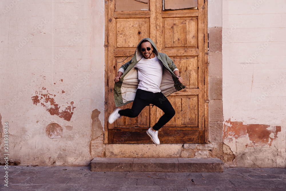 Young boy jumping on the street