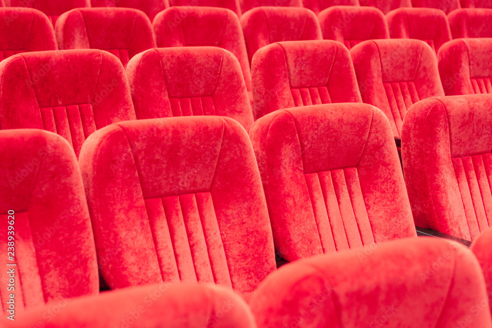 Fototapeta premium empty assembly hall with red chairs in rows. concept of trainings, business meetings and conferences.for decor and design background texture.