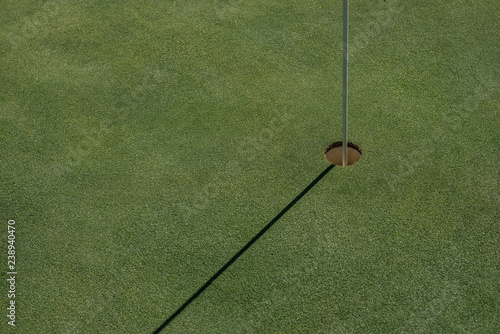Golf field with empty hole
