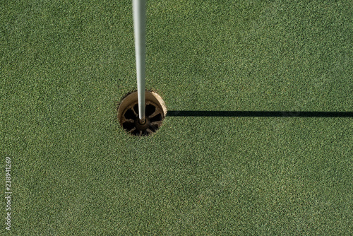 Golf field with empty hole