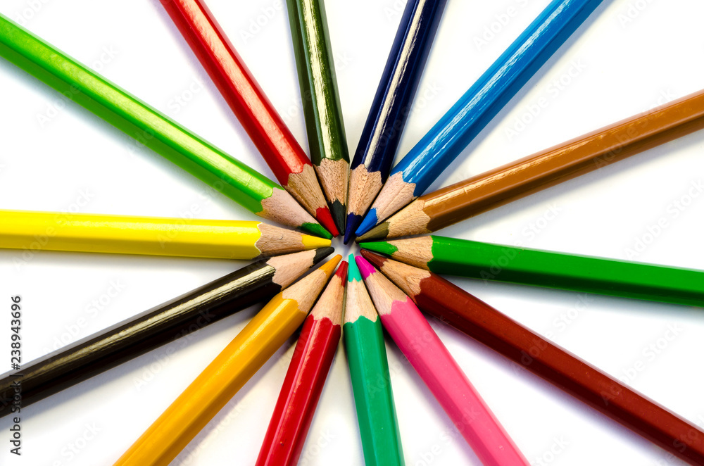 Color pencils pink light blue green yellow and red on white background. Color pencils pink light blue green yellow and red on white background.