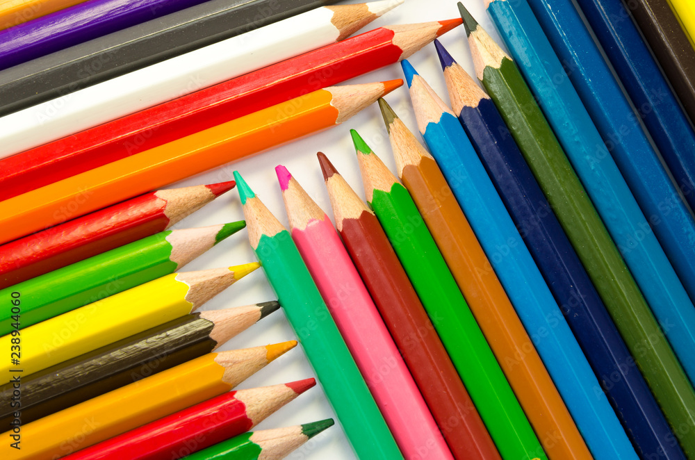 Color pencils pink light blue green yellow and red on white background. Color pencils pink light blue green yellow and red on white background.