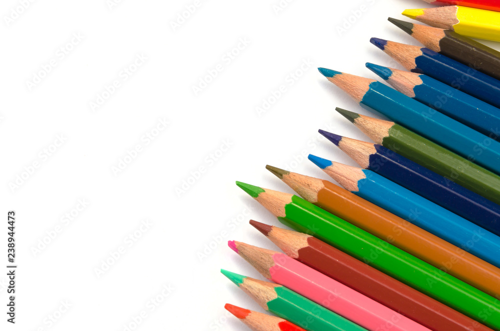 Color pencils pink light blue green yellow and red on white background. Color pencils pink light blue green yellow and red on white background.