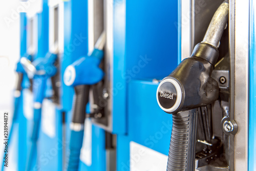 Bild auf Leinwand Side view stuck on a gas pump in the fuel nozzles