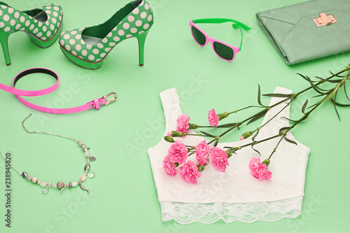 Fototapeta Naklejka Na Ścianę i Meble -  Fashion clothes accessories woman set on green