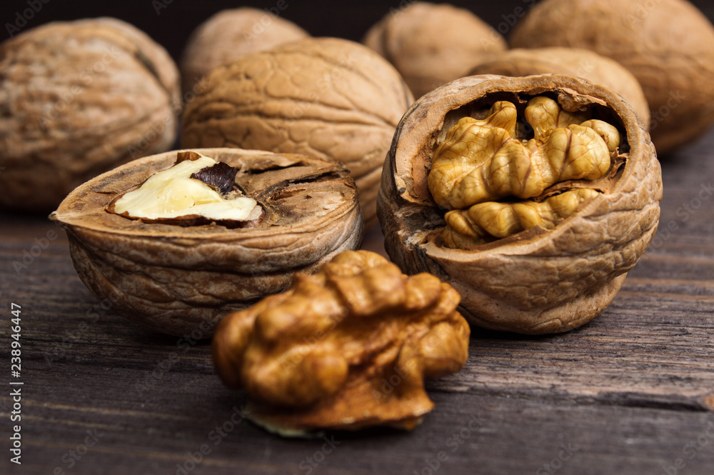 Handful of Walnuts on wooden background Handful of Walnuts on wooden background