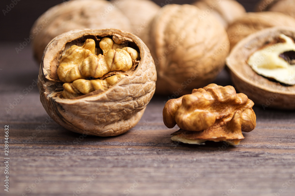 Handful of Walnuts on wooden background Handful of Walnuts on wooden background