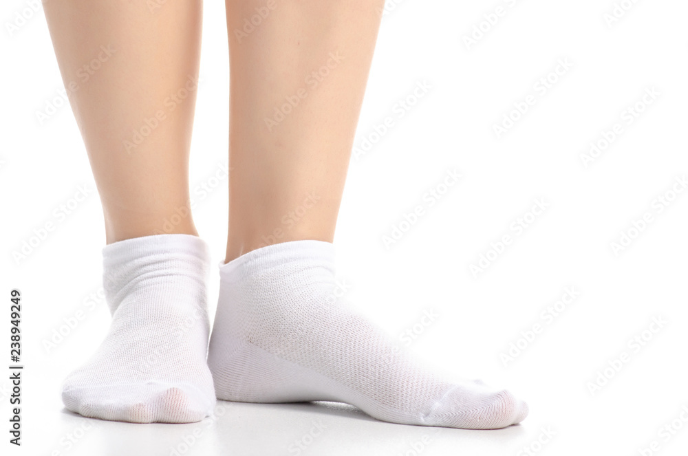Female legs in white socks on white background. Isolation