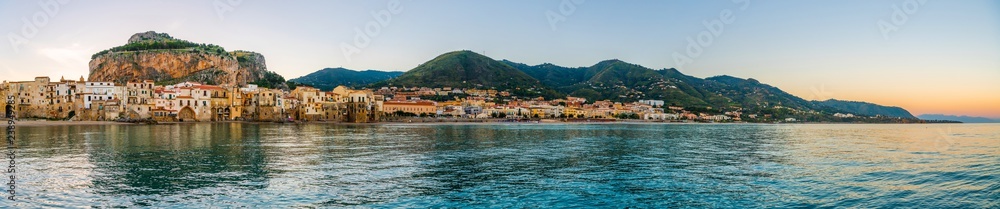 Panoramic view over the italian coastal city Cefalu from the sea, nothern Sicily, Italy