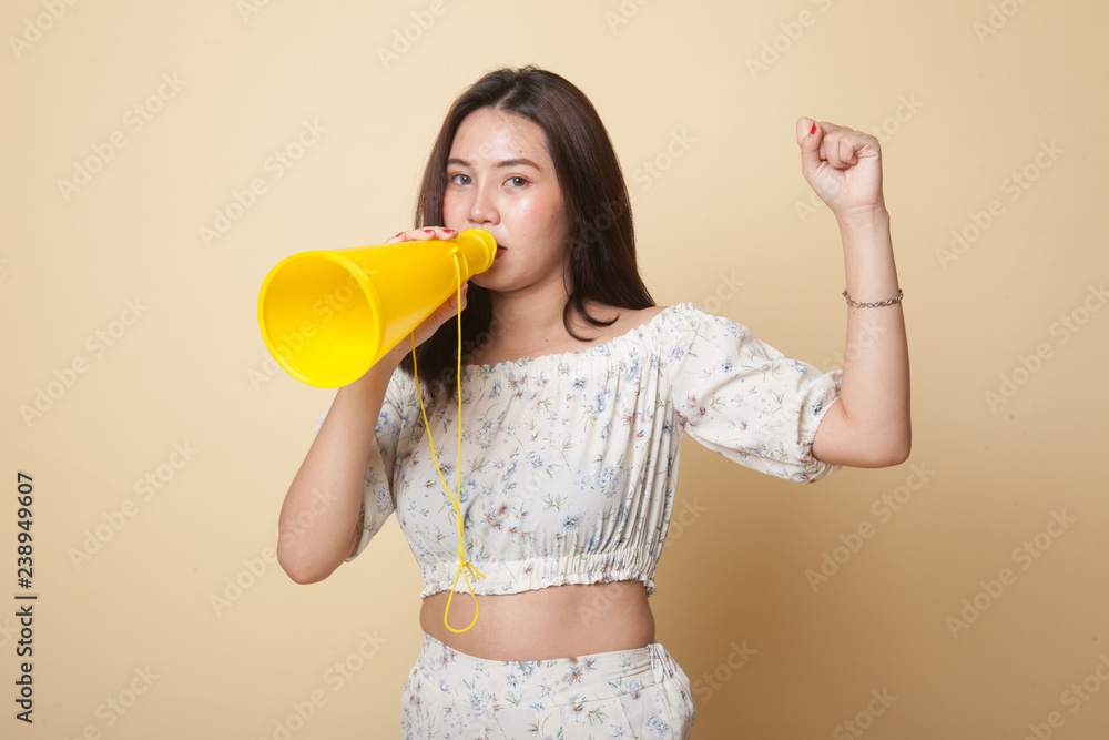 Beautiful young Asian woman announce with megaphone. Beautiful young Asian woman announce with megaphone.