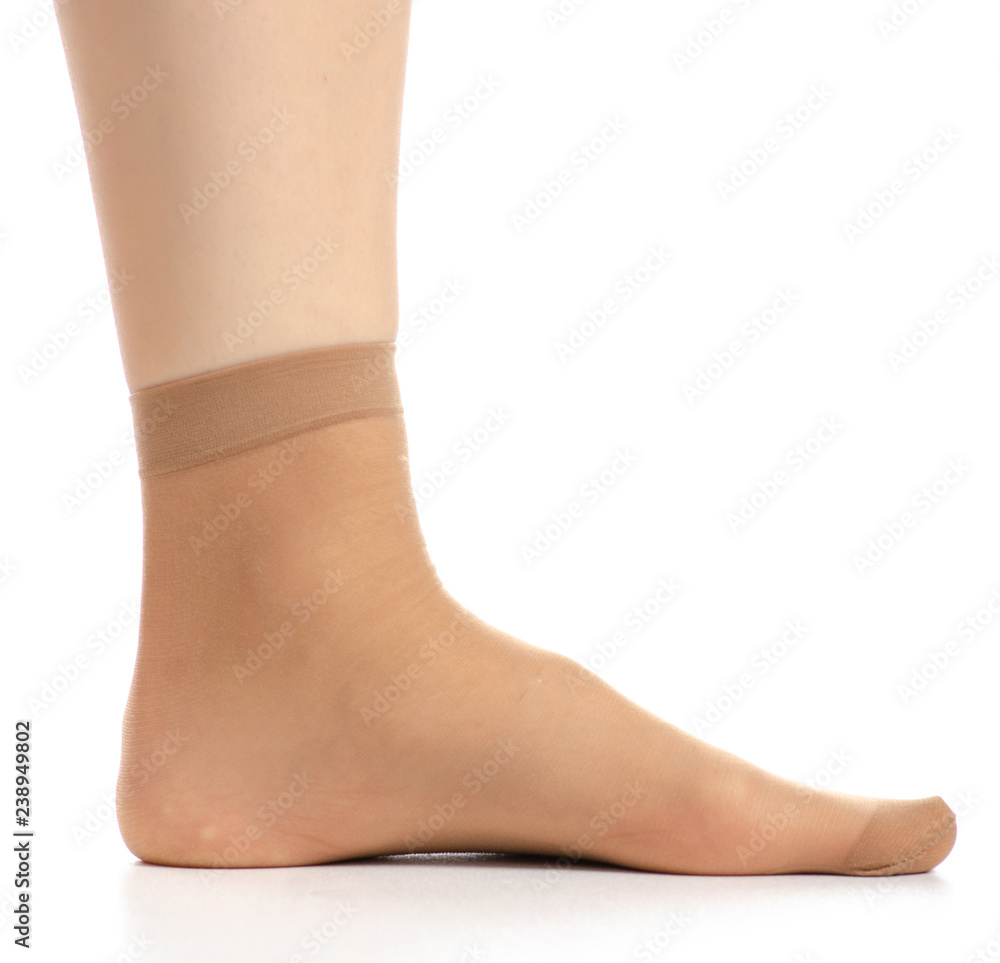Female legs in nylon socks on white background. Isolation Female legs in nylon socks on white background. Isolation