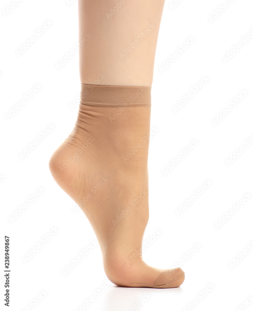 Female legs in nylon socks on white background. Isolation Female legs in nylon socks on white background. Isolation