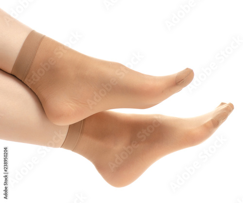 Fotografía Female legs in nylon socks on white background. Isolation