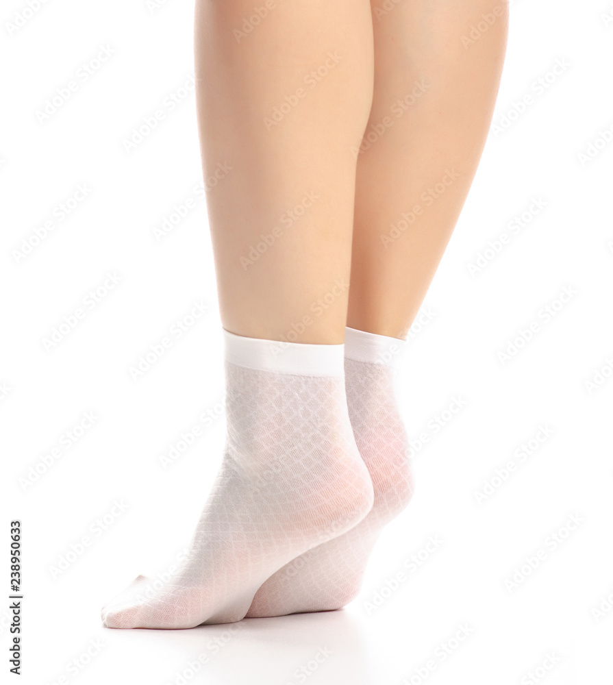 Female legs in white nylon socks on white background. Isolation Stock-Foto  | Adobe Stock
