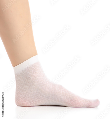 Female legs in white nylon socks on white background. Isolation