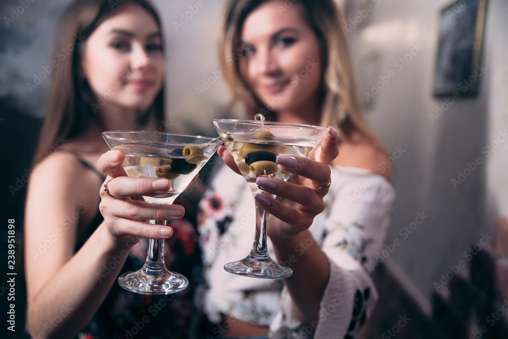 Girls with glasses of white wine in a nightclub Girls with glasses of white wine in a nightclub