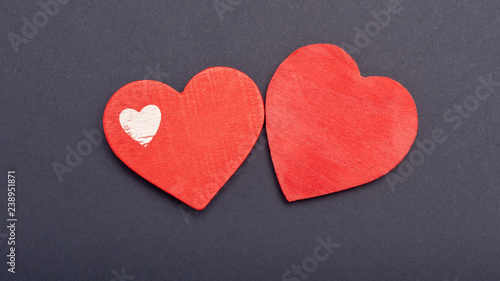 red heart on a dark paper background. The concept of Valentine's Day, the day of love, mother's day. Copy space background texture