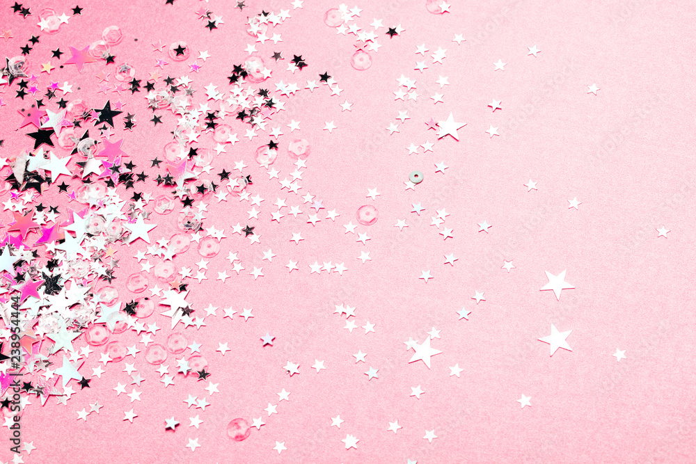 Silver star glitter on pink pastel background. Festive concept. Place for design. Silver star glitter on pink pastel background. Festive concept. Place for design.