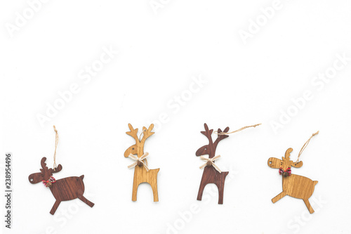 Wood christmas decoration on white background, top view, flat lay