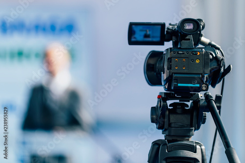 Press Conference Event. Cameraman Recording Male Speaker
