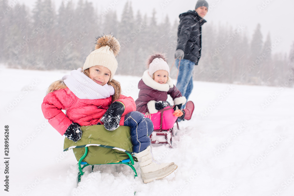 Family of dad and kids vacation on Christmas eve outdoors