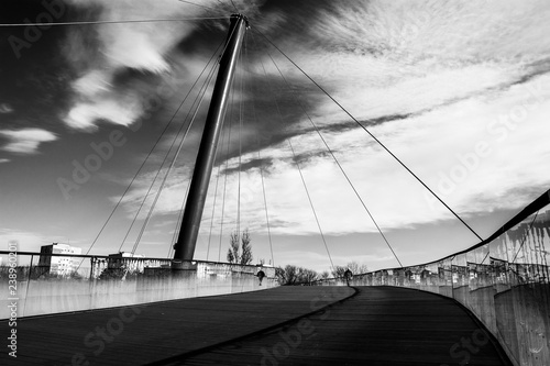 Weekend walk on the suspension bridge in Drumul Taberei Park, also known as Moghioros Park, in Bucharest, Romania. photo