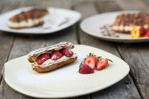 Strawberry eclairs on plate