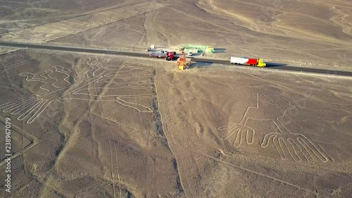 Aerial view of Ancient Nazca Lines. The Tree and The Hands. Rocky Desert.