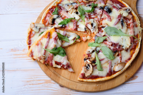 Tasty and flavorful pizza on the table. Appetizing homemade pizza.