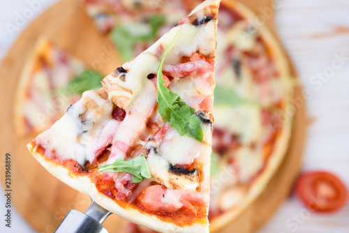 Tasty and flavorful pizza on the table. Appetizing homemade pizza. photo