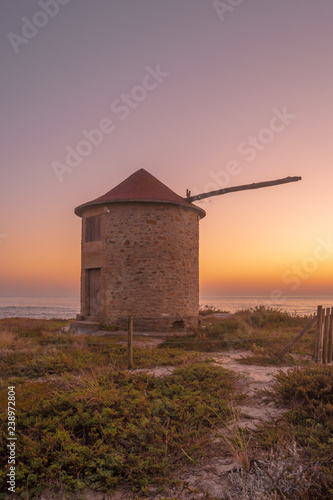 Old traditional wind-mills in sand-hills of Apulia Portugal