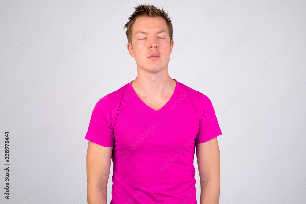 Young handsome man relaxing with eyes closed Young handsome man relaxing with eyes closed