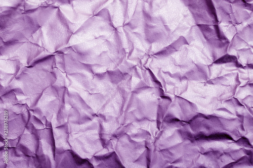 Wallpaper Mural Blurred abstract background of crumpled purple paper surface. Cropped shot, horizontal, blurred, top view. Torontodigital.ca