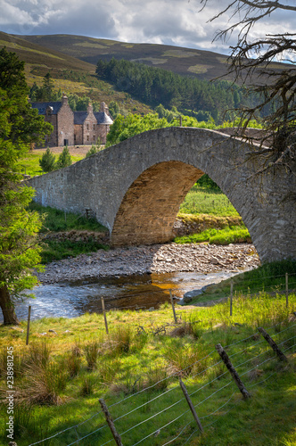 Stone Bridge over Creek with Estate in Scotland