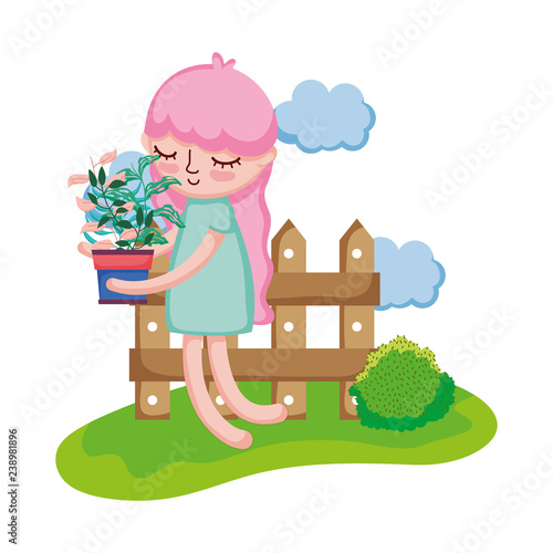 girl lifting houseplant with fence in the camp