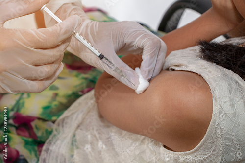 Healthy and medical concept, Doctor injecting vaccination in arm of child.