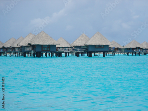 Fototapeta Naklejka Na Ścianę i Meble -  Overwater bungalow in beautiful blue ocean in Bora Bora, Tahiti