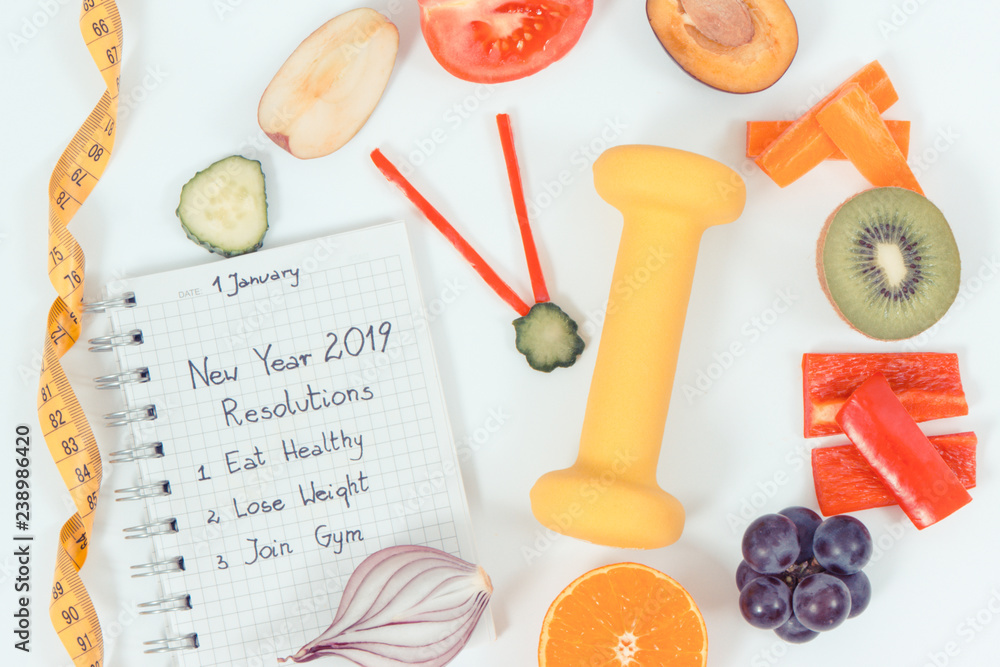 Clock shaped fruits with vegetables and centimeter. Healthy sporty lifestyles concept Clock shaped fruits with vegetables and centimeter. Healthy sporty lifestyles concept