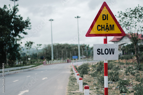 vietnam text sign slow on the road