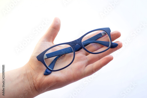 female hand spectacles on white background glasses