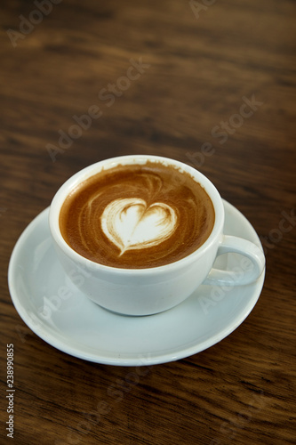Cup of coffee with heart pattern