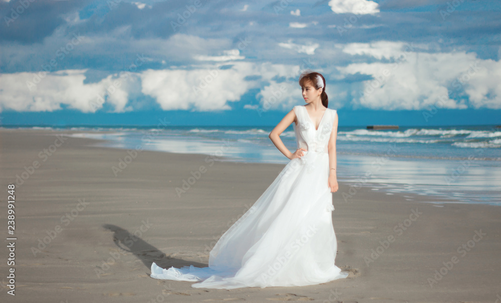 bride in white dress on the beach bride in white dress on the beach