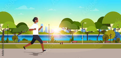 african american woman jogging outdoors modern public park girl headphones running sport activity concept cityscape sunset background horizontal banner flat
