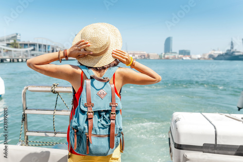 Photography Happy tourist woman traveler standing on cruise ship or ferry boat